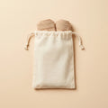 Zipleek Travel Pouch — holding two pairs of rolled beige compression socks